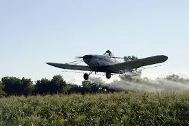 Crop Duster Spraying Roundup - Glyphosate