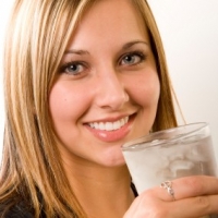Woman Holding Ice Water