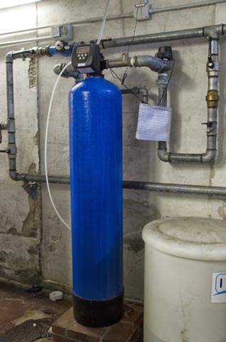 Plumbed water softener in basement.